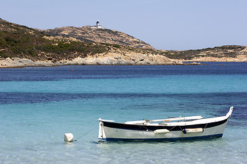 Image showing Traditional Corsican fishing boat anchored in bay corsica