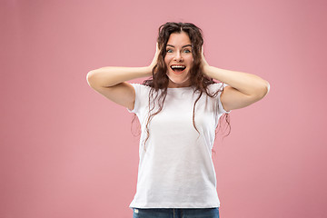 Image showing Beautiful woman looking suprised isolated on pink