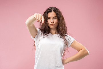 Image showing The overbearing business woman point you and want you, half length closeup portrait on pink background.