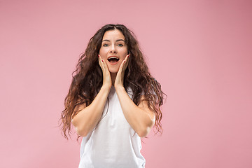 Image showing Beautiful woman looking suprised isolated on pink