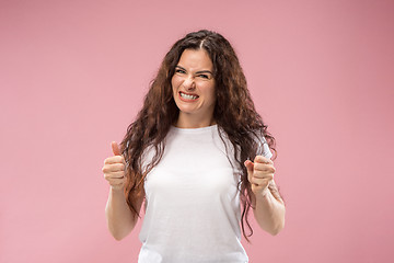 Image showing Portrait of an angry woman isolated on a pink background