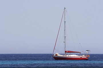 Image showing sailing yacht at anchor in bay Corsica