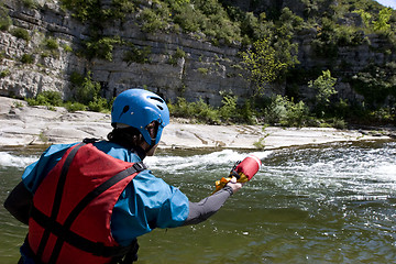 Image showing kayak paddlers practising river rescues