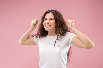 Image showing Portrait of an angry woman isolated on a pink background