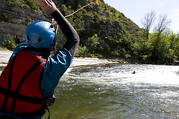 Image showing kayak paddlers practising river rescues