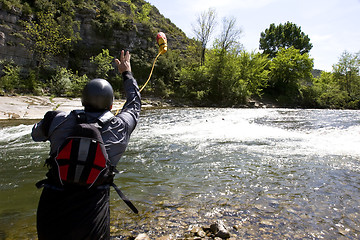 Image showing kayak paddlers practising river rescues