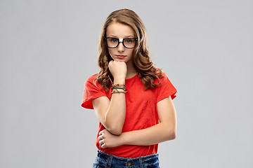 Image showing student girl in glasses thinking