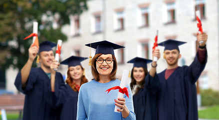 Image showing happy senior graduate student woman with diploma