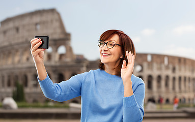 Image showing senior woman having video call on smartphone