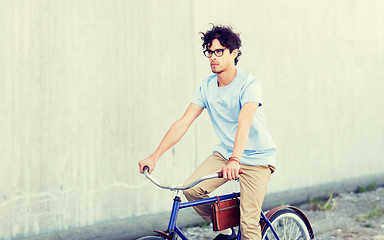 Image showing young hipster man riding fixed gear bike