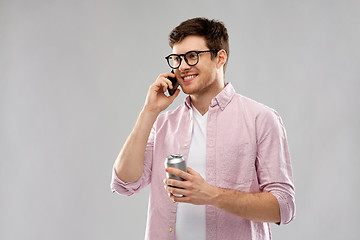 Image showing young man in glasses with smartphone and drink