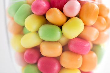 Image showing close up of glass jar with colorful candy drops