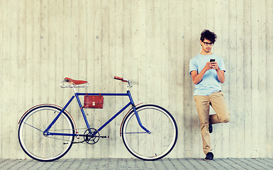 Image showing man with smartphone and fixed gear bike on street