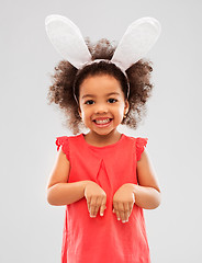 Image showing happy little girl wearing easter bunny ears