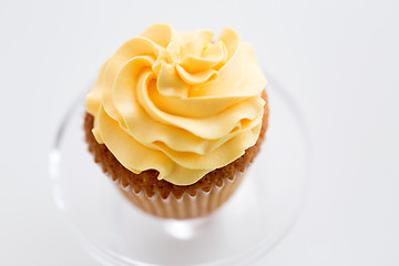 Image showing cupcake with frosting on confectionery stand