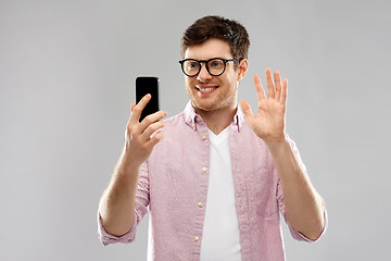 Image showing smiling man having video call on smartphone