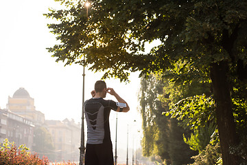 Image showing man jogging at sunny morning