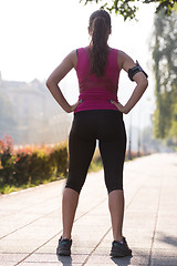 Image showing woman jogging at sunny morning