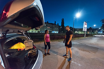 Image showing couple warming up and stretching