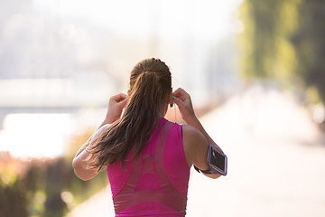 Image showing woman jogging at sunny morning