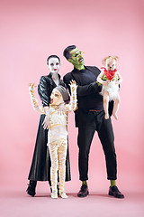 Image showing Halloween Family. Happy Father, Mother and Children Girls in Halloween Costume and Makeup