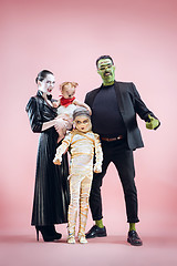 Image showing Halloween Family. Happy Father, Mother and Children Girls in Halloween Costume and Makeup