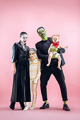 Image showing Halloween Family. Happy Father, Mother and Children Girls in Halloween Costume and Makeup