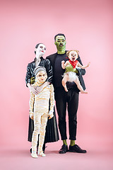 Image showing Halloween Family. Happy Father, Mother and Children Girls in Halloween Costume and Makeup