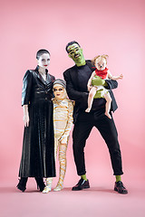 Image showing Halloween Family. Happy Father, Mother and Children Girls in Halloween Costume and Makeup