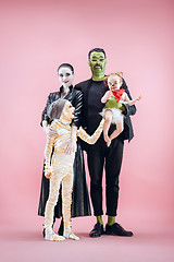 Image showing Halloween Family. Happy Father, Mother and Children Girls in Halloween Costume and Makeup