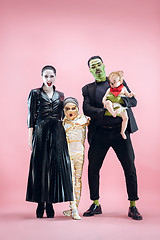 Image showing Halloween Family. Happy Father, Mother and Children Girls in Halloween Costume and Makeup