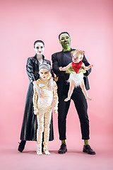 Image showing Halloween Family. Happy Father, Mother and Children Girls in Halloween Costume and Makeup