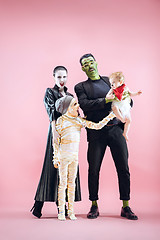 Image showing Halloween Family. Happy Father, Mother and Children Girls in Halloween Costume and Makeup