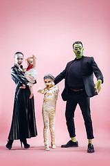 Image showing Halloween Family. Happy Father, Mother and Children Girls in Halloween Costume and Makeup