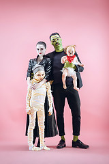 Image showing Halloween Family. Happy Father, Mother and Children Girls in Halloween Costume and Makeup