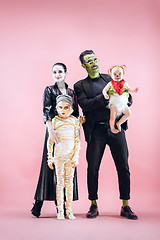 Image showing Halloween Family. Happy Father, Mother and Children Girls in Halloween Costume and Makeup