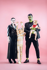 Image showing Halloween Family. Happy Father, Mother and Children Girls in Halloween Costume and Makeup