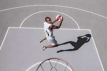 Image showing Picture of young confused african basketball player practicing