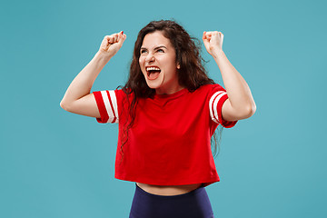 Image showing Winning success woman happy ecstatic celebrating being a winner. Dynamic energetic image of female model