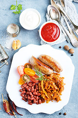 Image showing sausages with fried cabbage