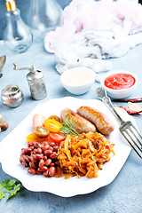Image showing sausages with fried cabbage