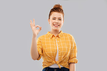 Image showing happy red haired teenage girl showing ok hand sign