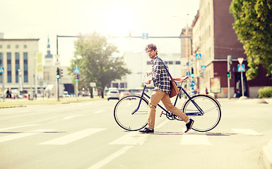 Image showing young man with fixed gear bicycle on crosswalk