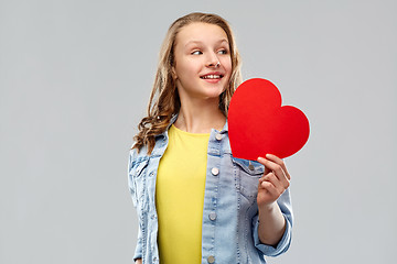 Image showing smiling teenage girl with red heart