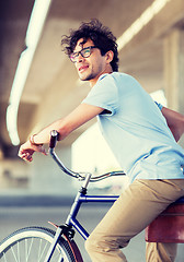 Image showing young hipster man riding fixed gear bike