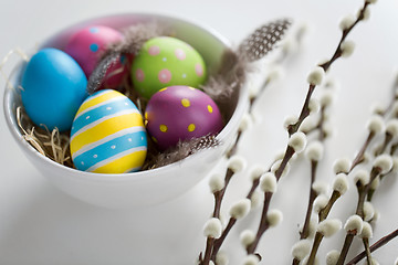 Image showing colored easter eggs and pussy willow branches