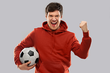 Image showing happy man or football fan with soccer ball winning