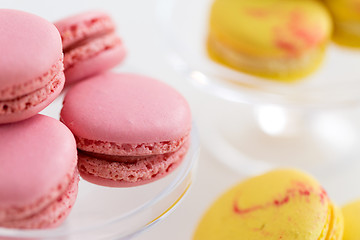 Image showing close up of pink and yellow macarons