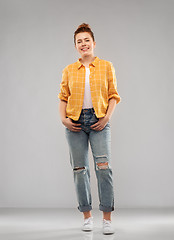 Image showing red haired teenage girl in shirt and torn jeans