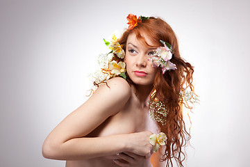 Image showing Portrait of beautiful naked woman with spring flowers 